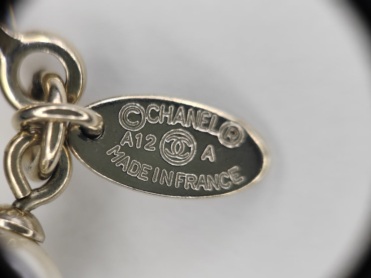 Chanel - Other - Gold-tone base metal with imitation pearls and decorative motifs. - Multicolour