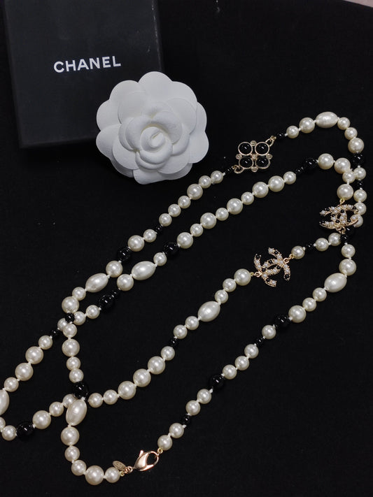 Chanel - Other - Gold-tone base metal with imitation pearls, black beads and crystal embellishments. - Multicolour