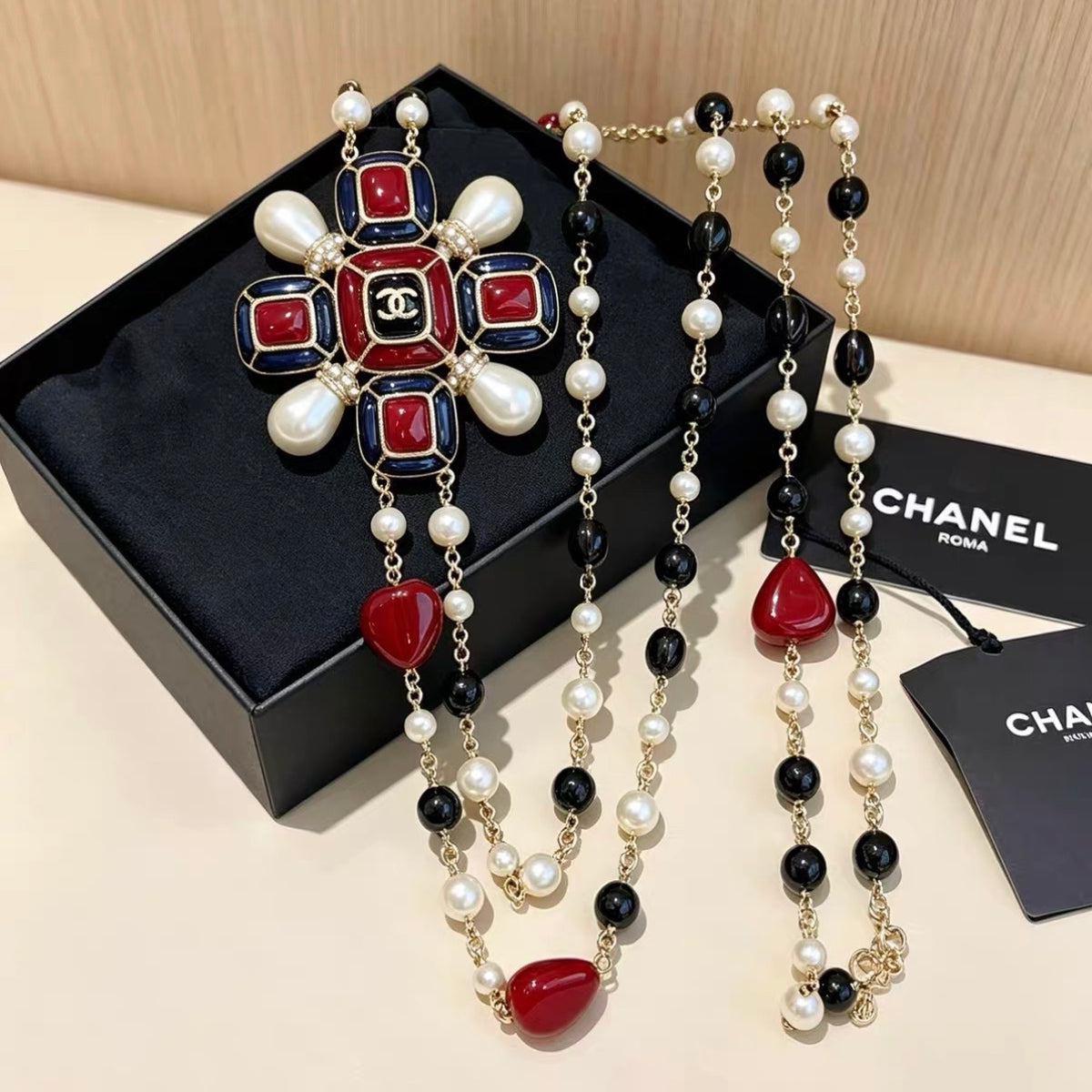 Chanel - Other - Gold-tone base metal with imitation pearls, enamel and resin beads. - Multicolour