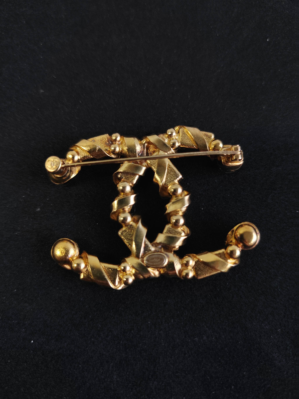 Chanel - Other - Gold-tone base metal with pearl, clear rhinestone or crystal, and black stone-like accents; exact stone and pearl composition is unspecified. - Multicolour