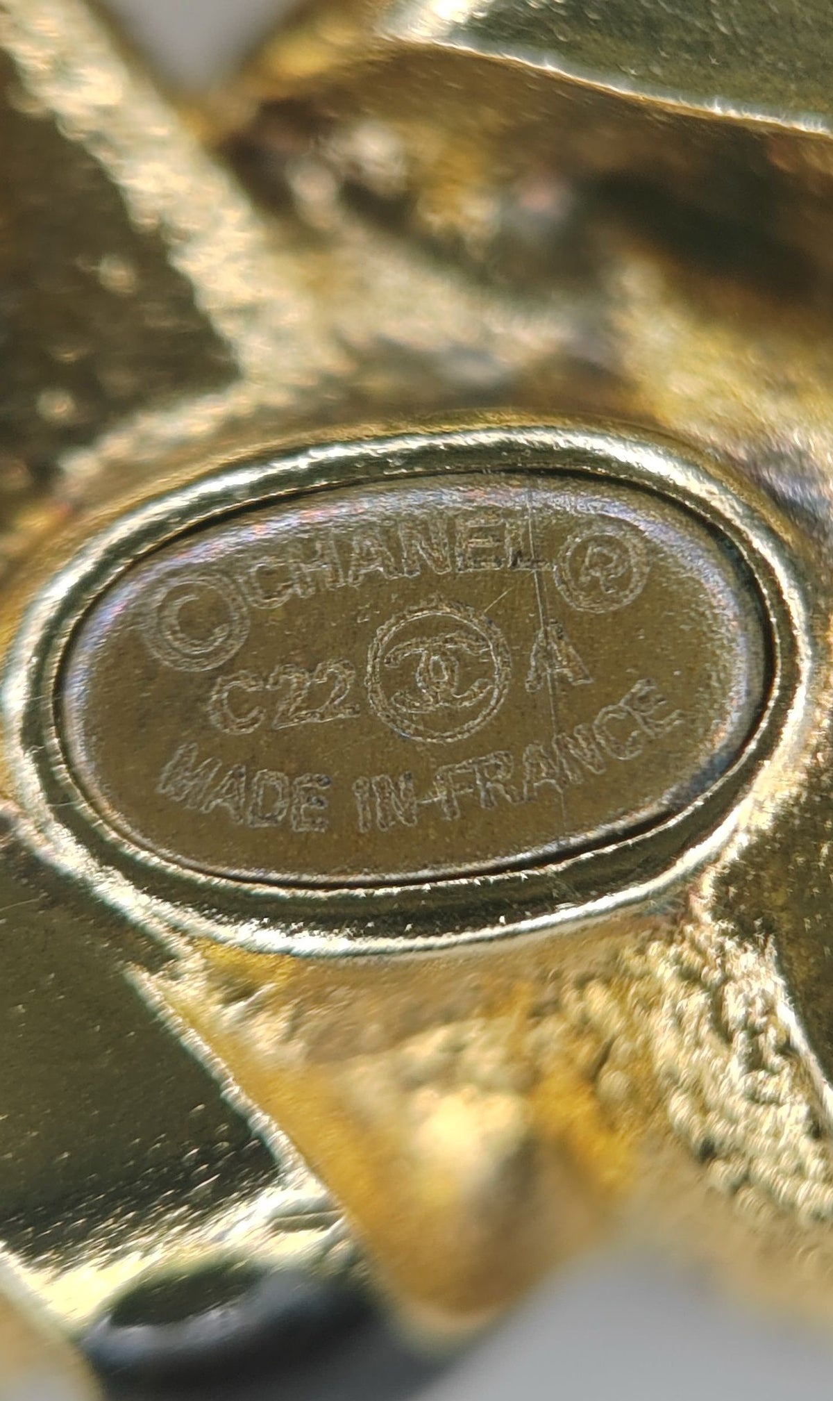 Chanel - Other - Gold-tone base metal with pearl, clear rhinestone or crystal, and black stone-like accents; exact stone and pearl composition is unspecified. - Multicolour