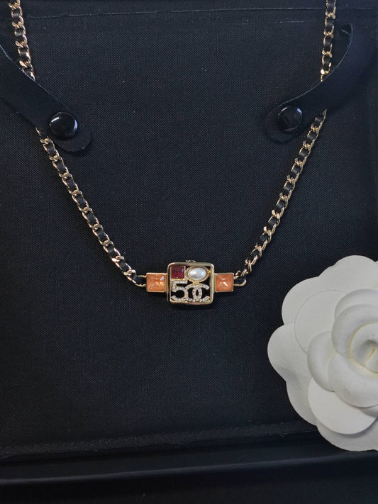 Chanel - Other - Gold-tone base metal with rhinestone and faux pearl embellishments. - Multicolour