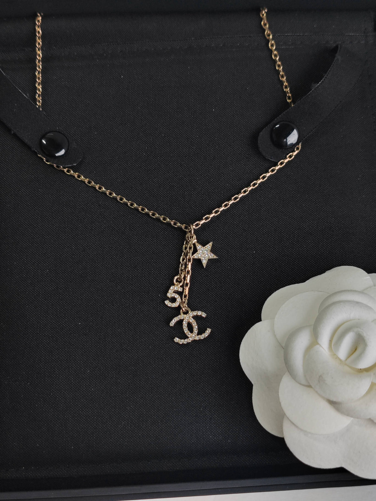 Chanel - Other - Gold-tone base metal with rhinestone-set charms and pearl-like bead accents. - Gold