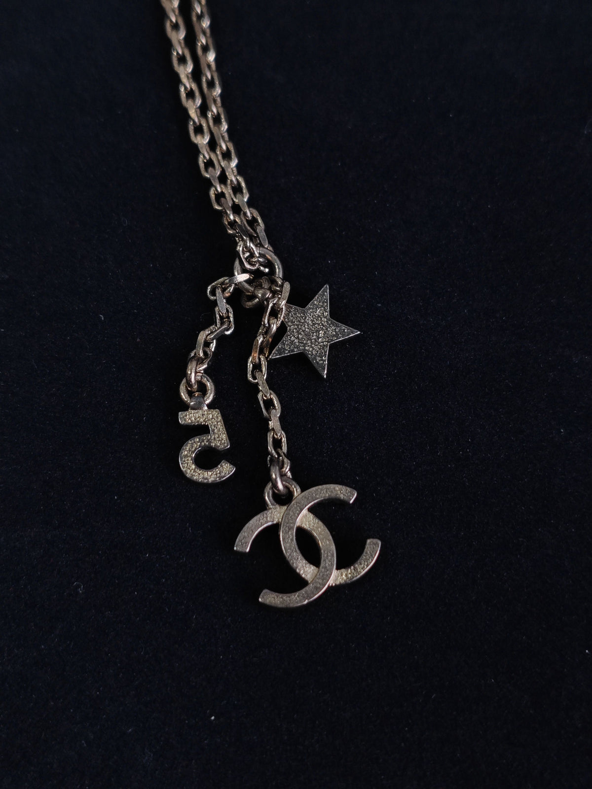 Chanel - Other - Gold-tone base metal with rhinestone-set charms and pearl-like bead accents. - Gold