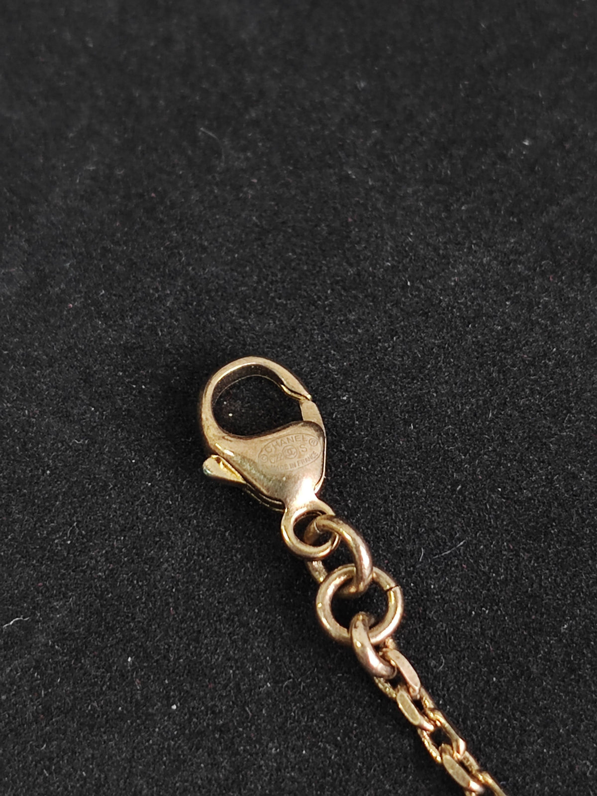 Chanel - Other - Gold-tone base metal with rhinestone-set charms and pearl-like bead accents. - Gold