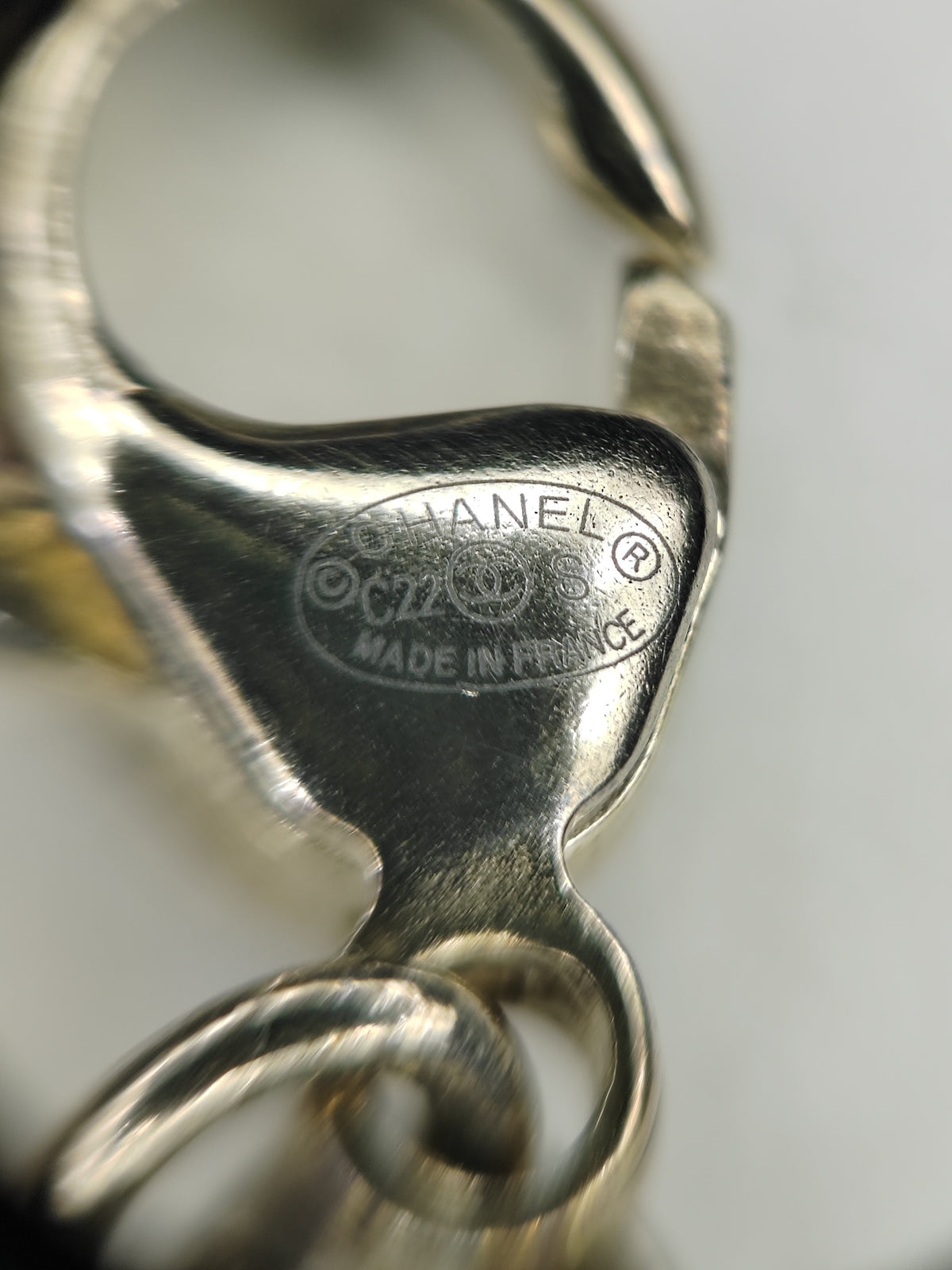 Chanel - Other - Gold-tone base metal with rhinestone-set charms and pearl-like bead accents. - Gold