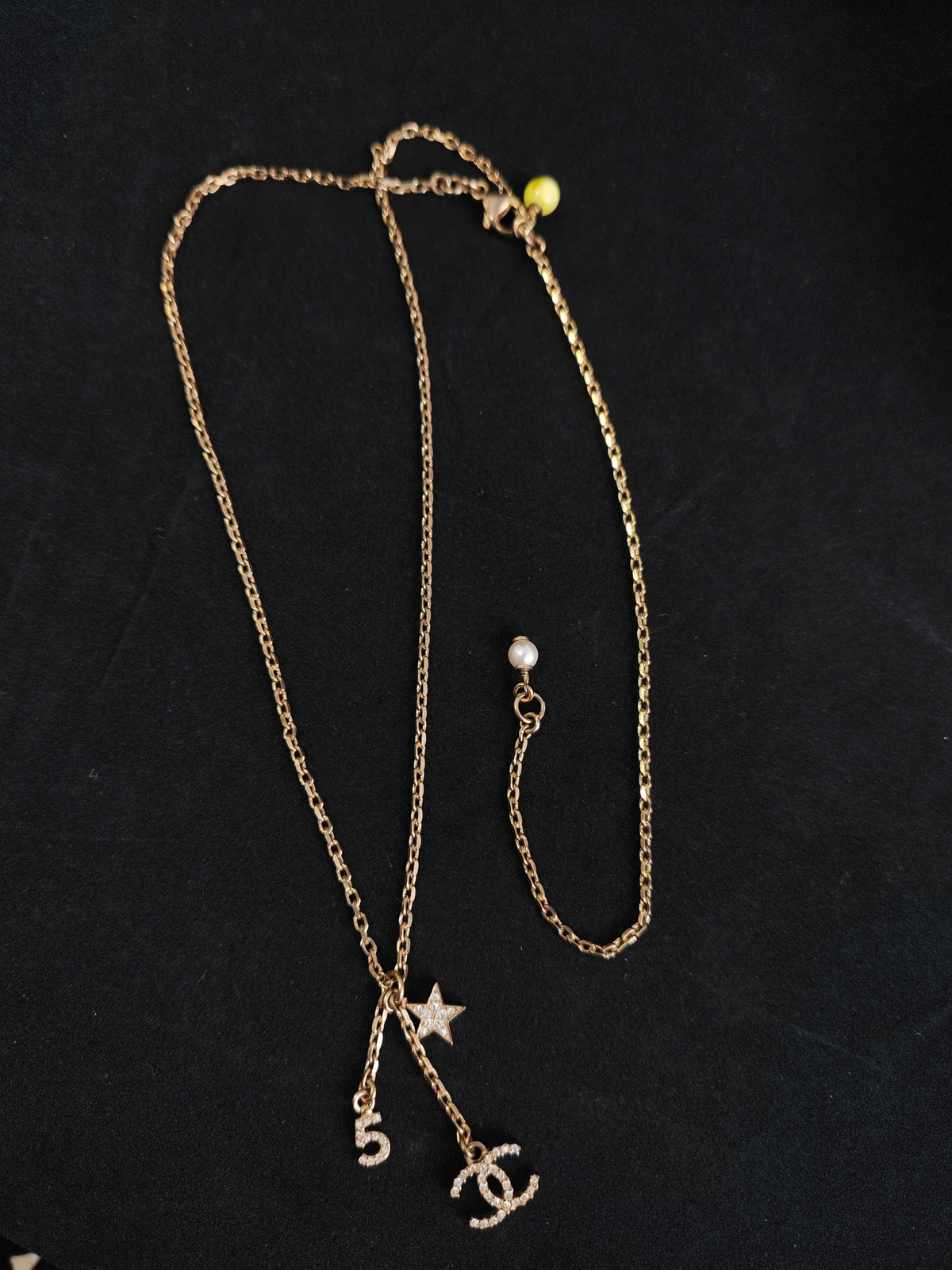 Chanel - Other - Gold-tone base metal with rhinestone-set charms and pearl-like bead accents. - Gold