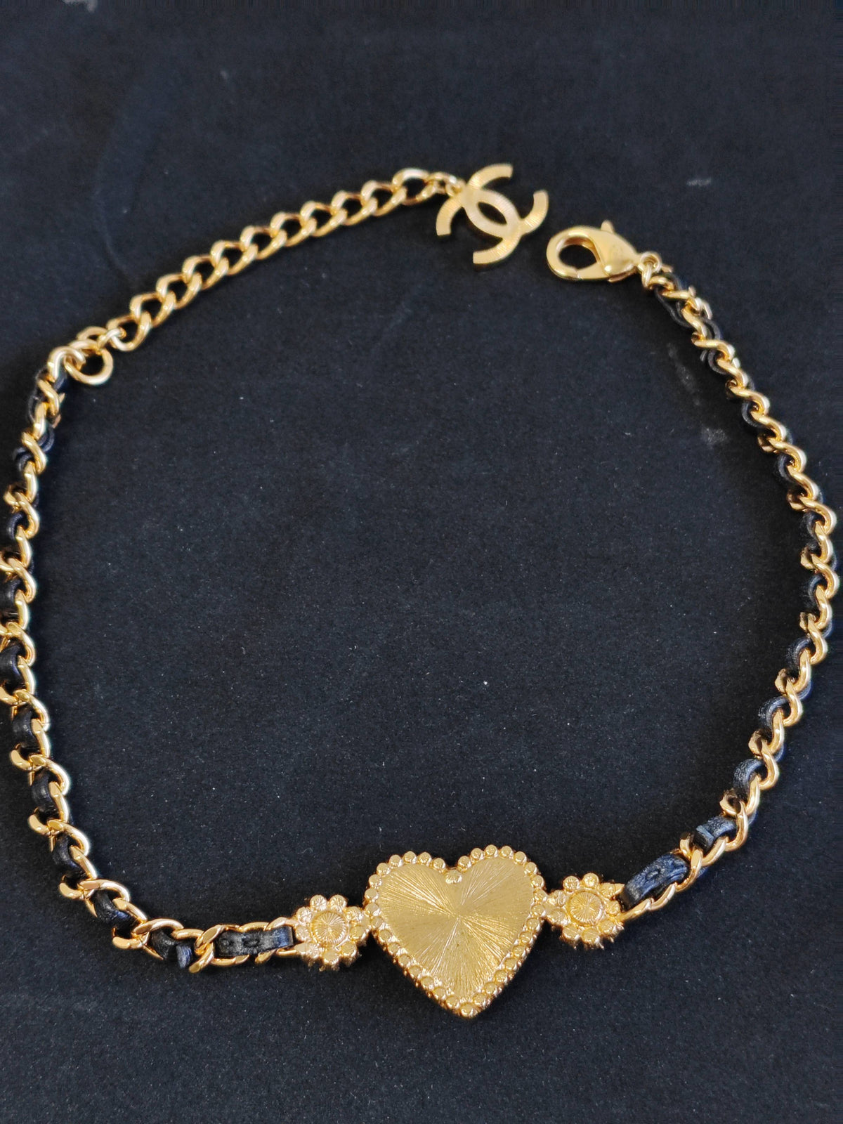 Chanel - Other - Gold-tone base metal with rhinestones and pearl accents; black leather woven through the chain. - Gold