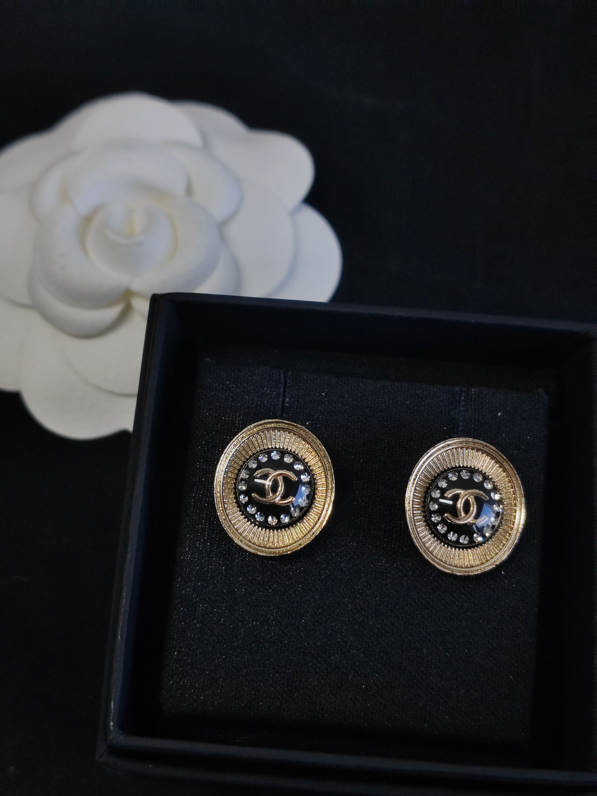 Chanel - Other - Gold-tone metal alloy with glass rhinestones and black enamel. - Multicolour