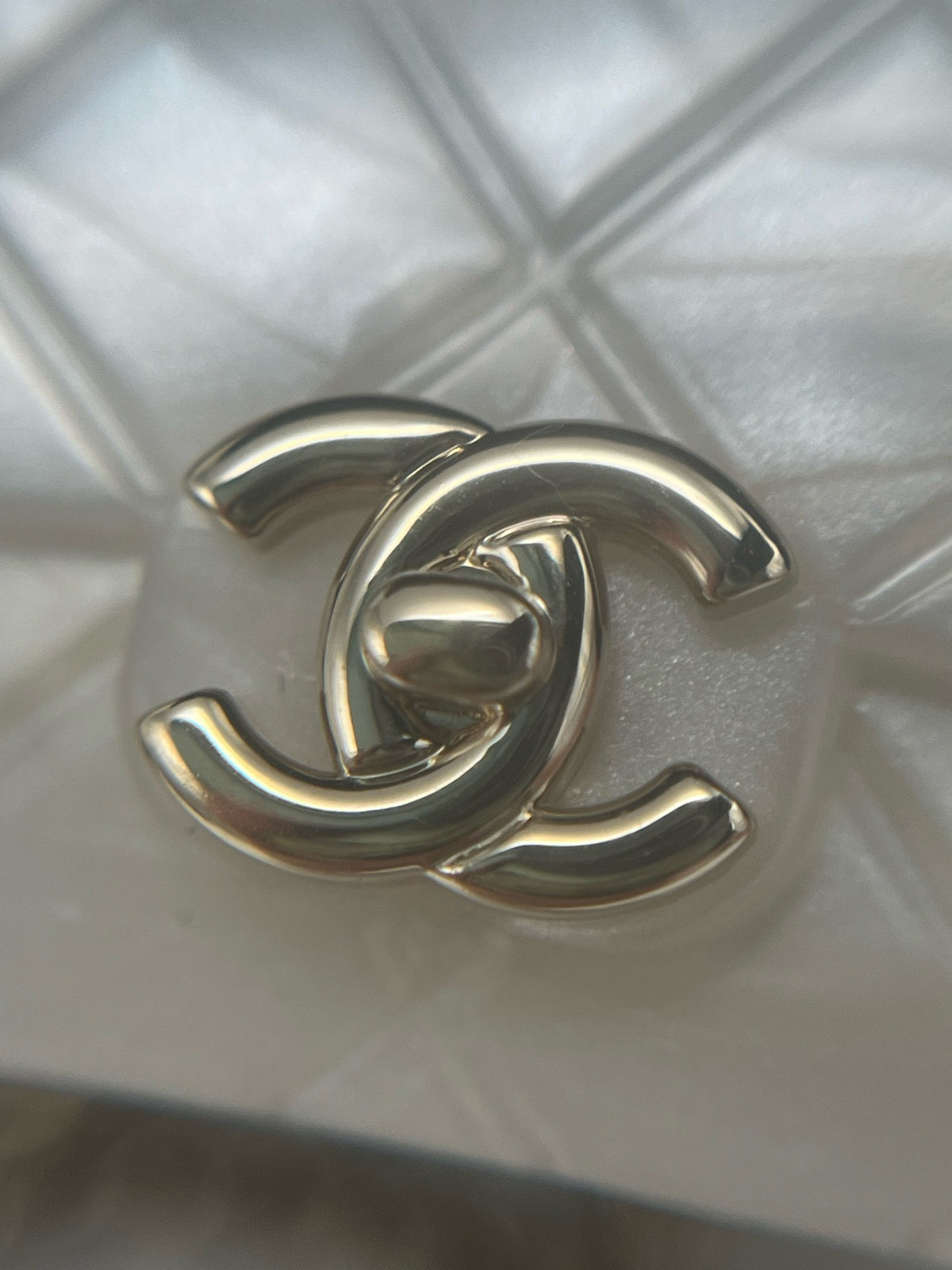 Chanel - Other - Gold-tone metal chain and hardware with a pearlescent white resin pendant. - White - (One size)