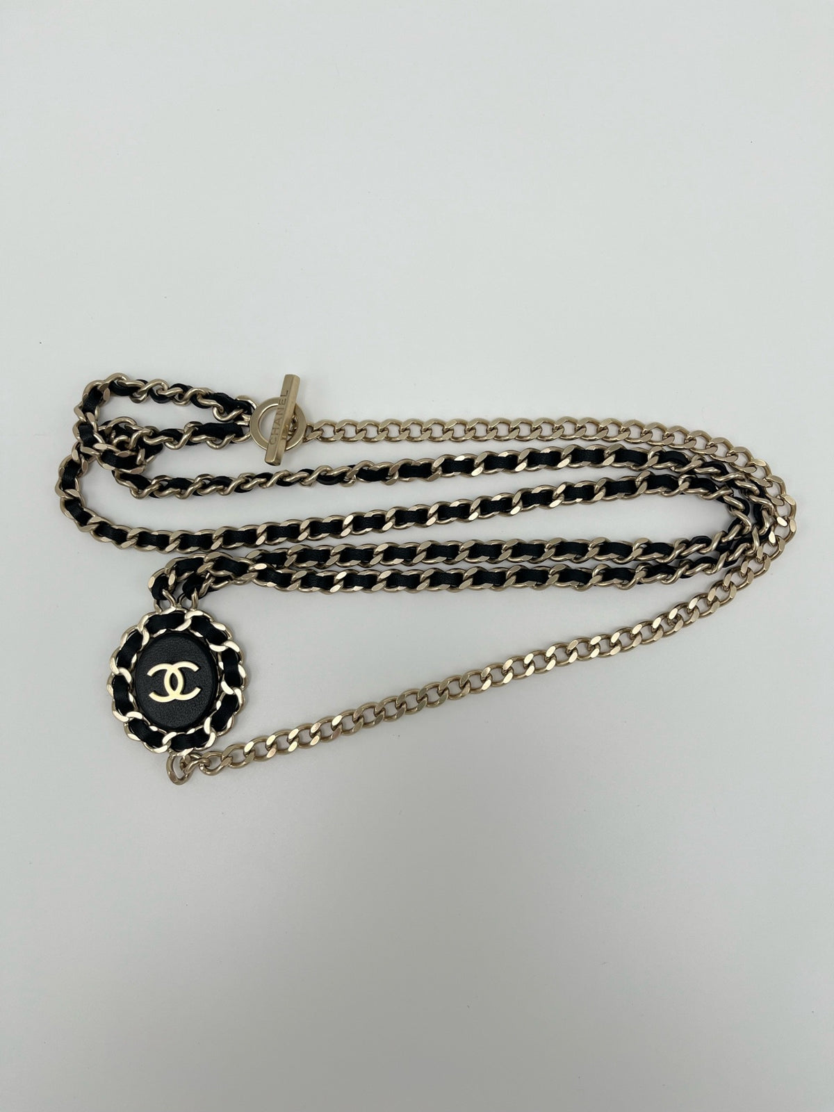 Chanel - Other - Gold-tone metal chain with black leather woven through it. - Multicolour - (Mid-length)