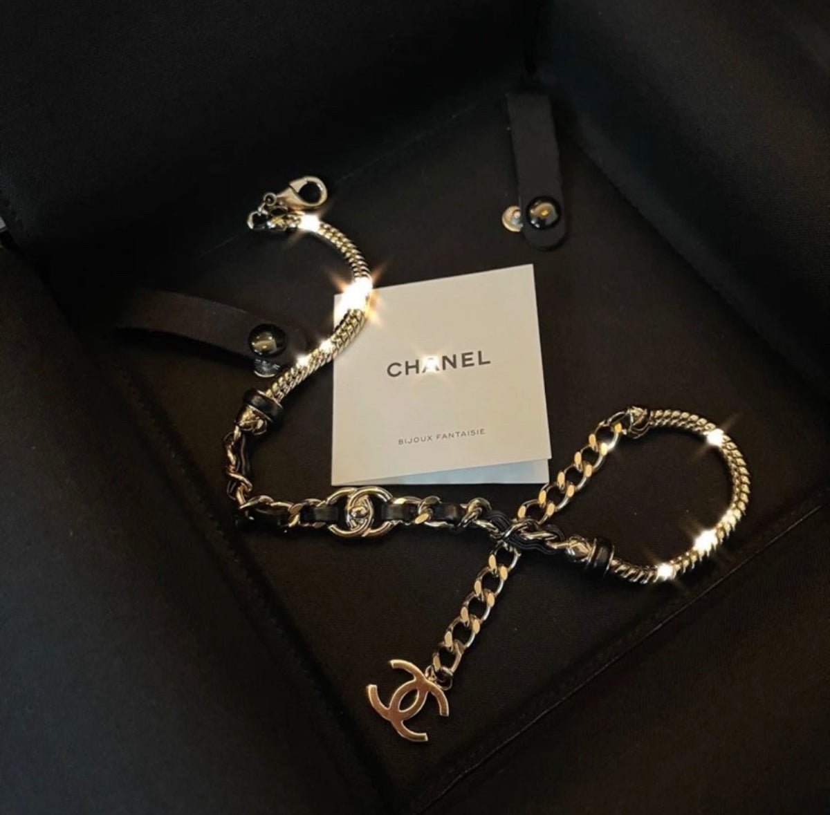 Chanel - Other - Gold-tone metal chain with black leather woven through sections; metal composition unspecified. - Multicolour