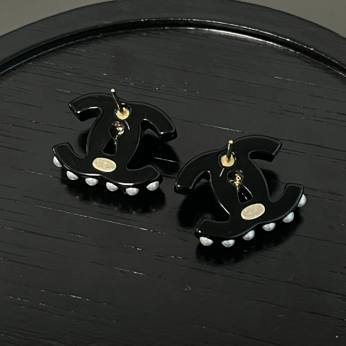 Chanel - Other - Gold-tone metal details with rhinestones, pearl and black resin elements; exact composition not confirmed. - Black