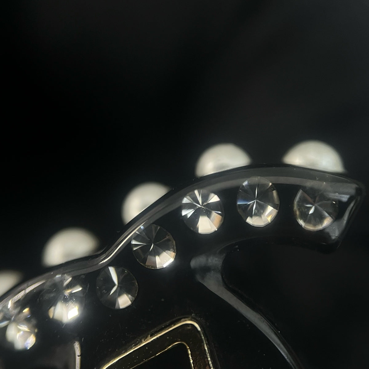 Chanel - Other - Gold-tone metal details with rhinestones, pearl and black resin elements; exact composition not confirmed. - Black