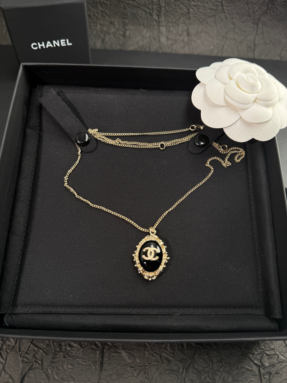 Chanel - Other - Gold-tone metal with a black cabochon; the cabochon composition is unverified. - Multicolour