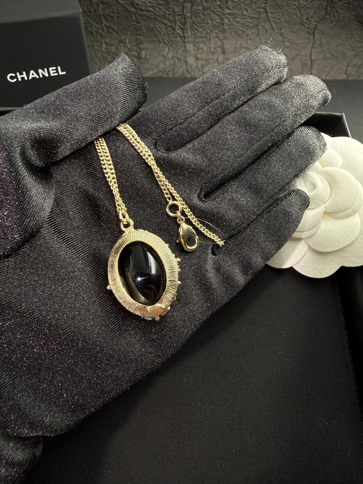 Chanel - Other - Gold-tone metal with a black cabochon; the cabochon composition is unverified. - Multicolour