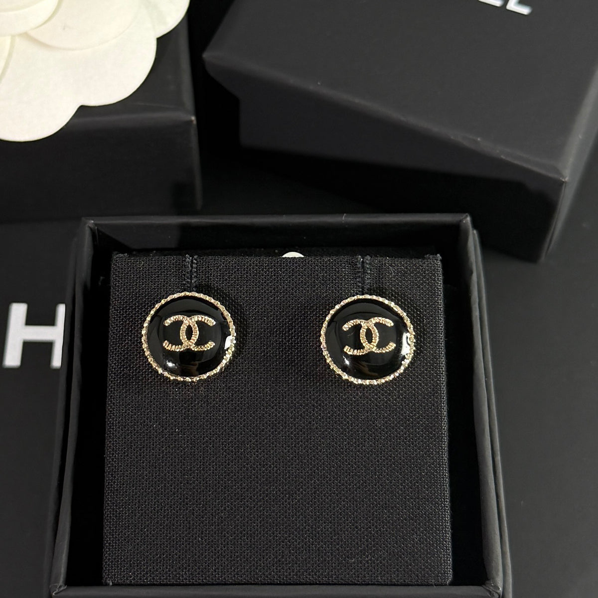 Chanel - Other - Gold-tone metal with a black enamel or resin centre; exact centre material is unconfirmed. - Black