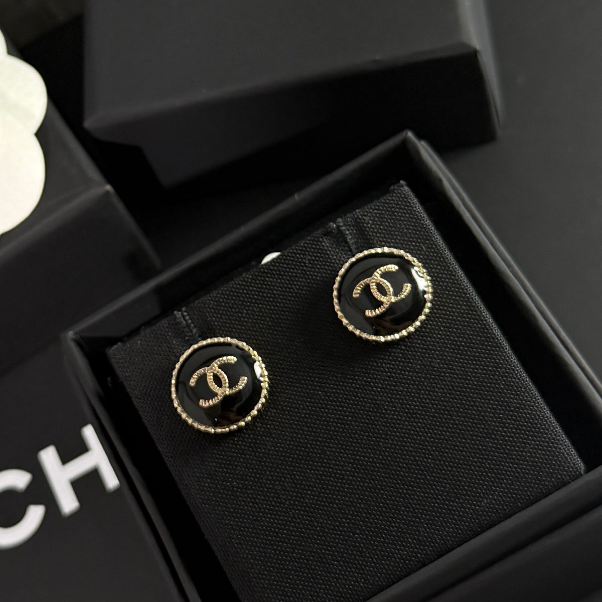 Chanel - Other - Gold-tone metal with a black enamel or resin centre; exact centre material is unconfirmed. - Black
