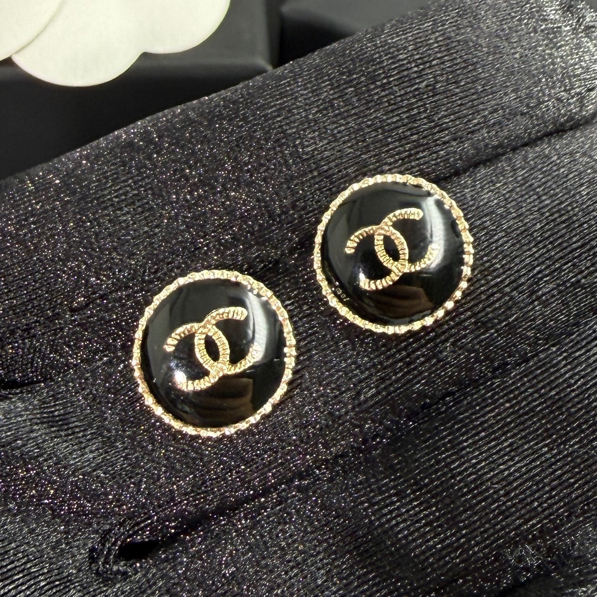 Chanel - Other - Gold-tone metal with a black enamel or resin centre; exact centre material is unconfirmed. - Black