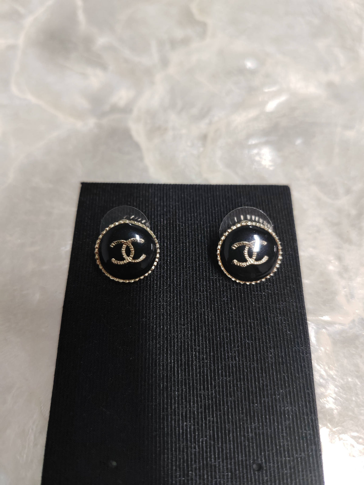 Chanel - Other - Gold-tone metal with a black resin-like front and rhinestone embellishments. - Black