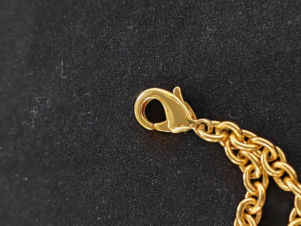 Chanel - Other - Gold-tone metal with a faux pearl detail; exact alloy unspecified - Gold