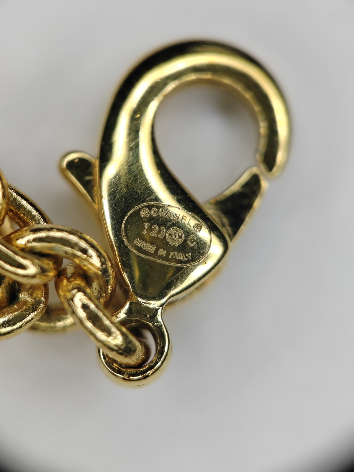 Chanel - Other - Gold-tone metal with a faux pearl detail; exact alloy unspecified - Gold