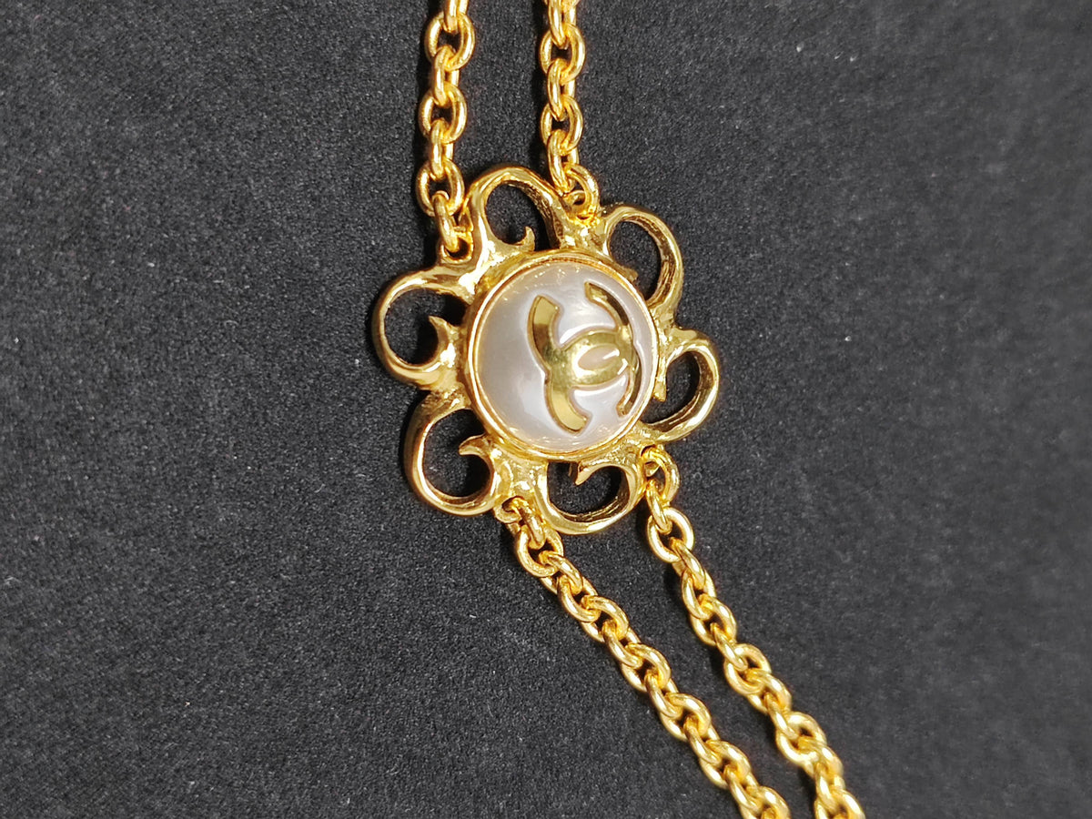 Chanel - Other - Gold-tone metal with a faux pearl detail; exact alloy unspecified - Gold