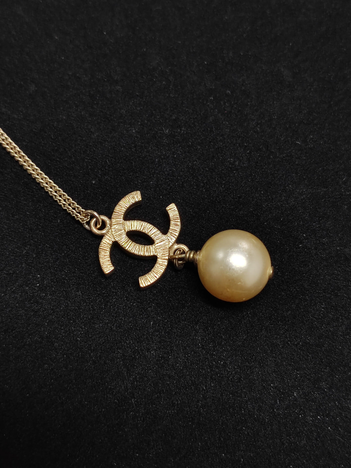 Chanel - Other - Gold-tone metal with a faux pearl pendant; exact pearl composition is unknown. - Gold
