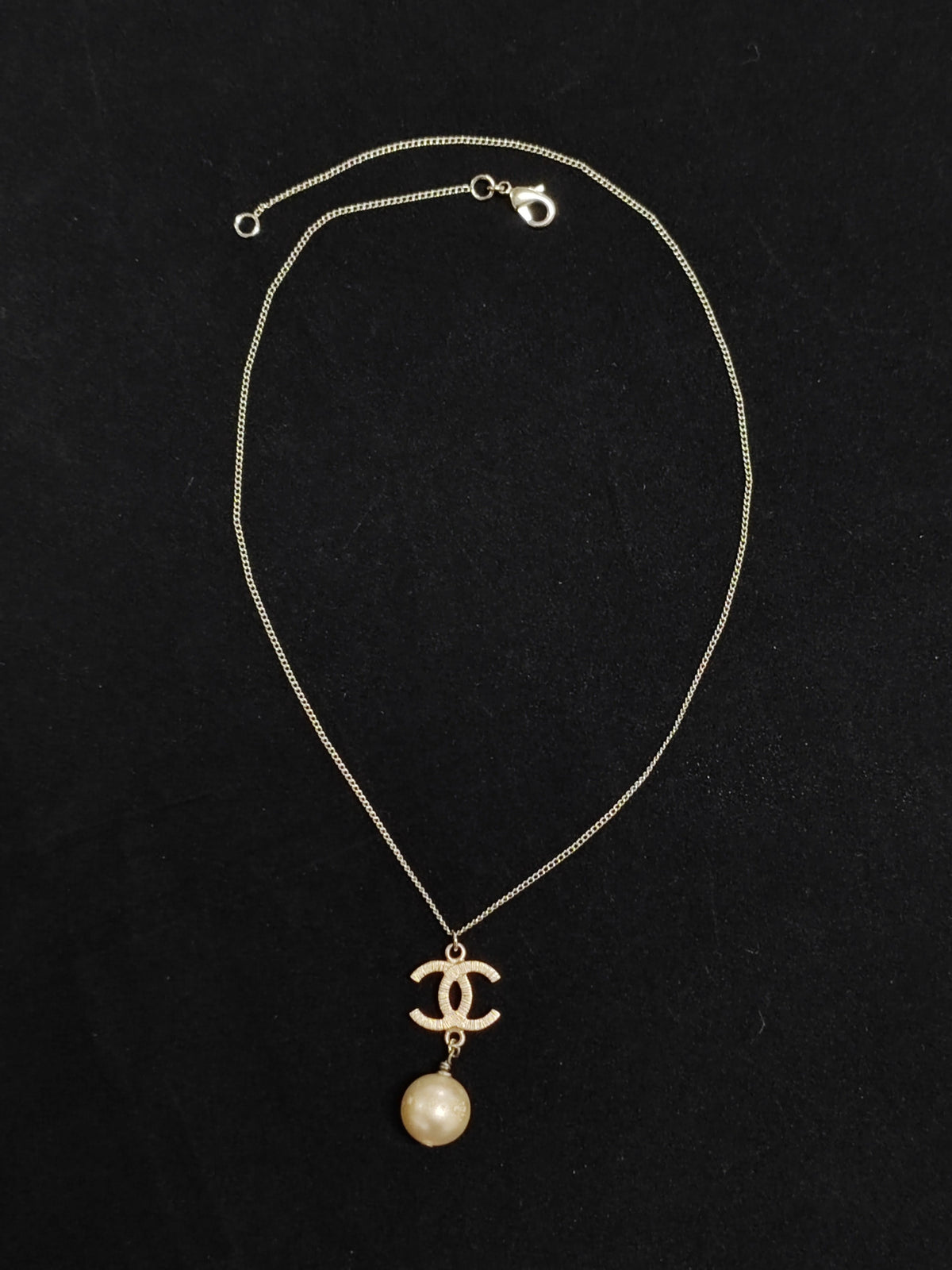 Chanel - Other - Gold-tone metal with a faux pearl pendant; exact pearl composition is unknown. - Gold