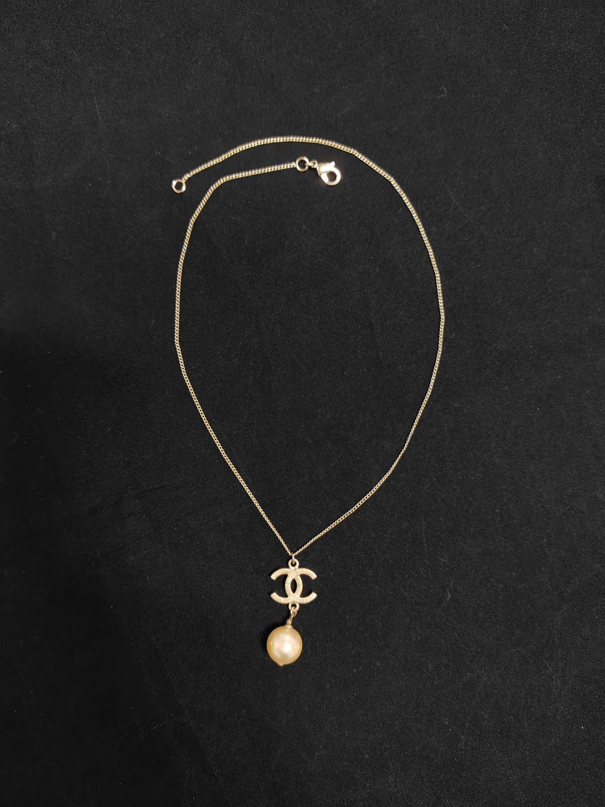 Chanel - Other - Gold-tone metal with a faux pearl pendant; exact pearl composition is unknown. - Gold