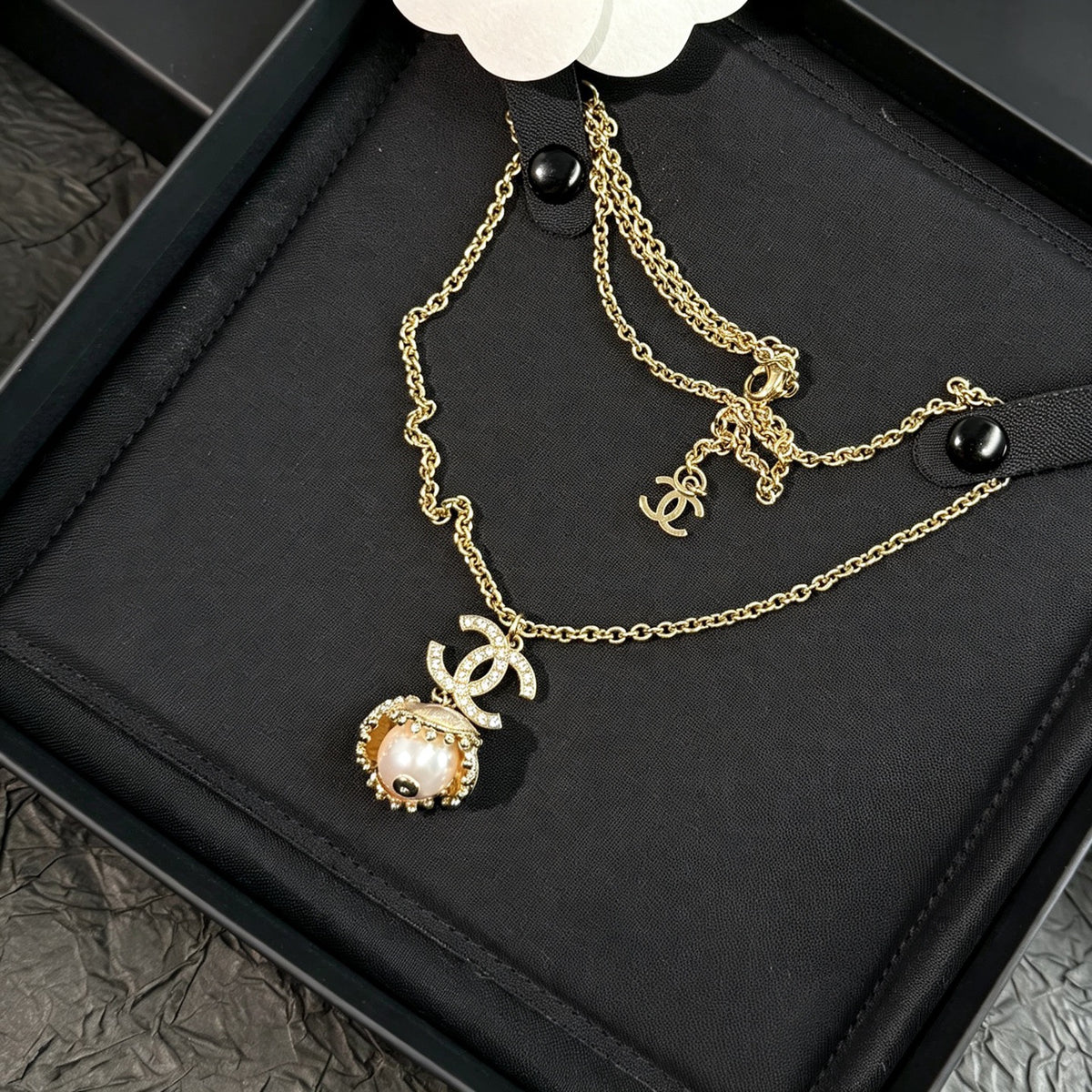 Chanel - Other - Gold-tone metal with a pearl-style pendant and clear decorative stones. - Gold