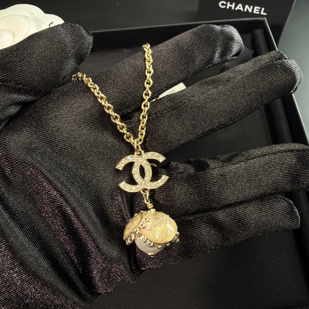 Chanel - Other - Gold-tone metal with a pearl-style pendant and clear decorative stones. - Gold