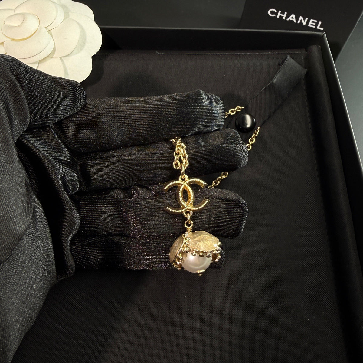 Chanel - Other - Gold-tone metal with a pearl-style pendant and clear decorative stones. - Gold