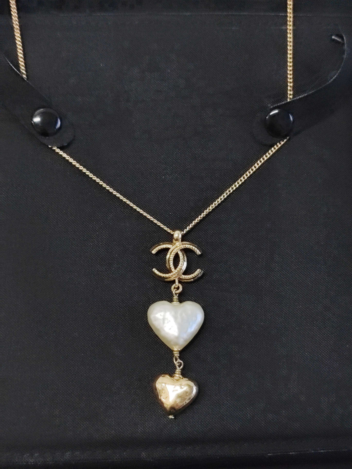Chanel - Other - Gold-tone metal with a white heart-shaped faux-pearl pendant and a gold-tone heart charm. - Multicolour