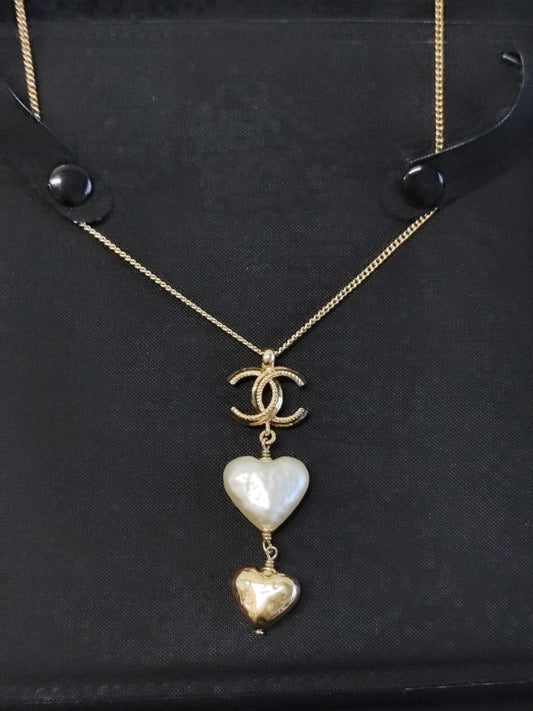 Chanel - Other - Gold-tone metal with a white heart-shaped faux-pearl pendant and a gold-tone heart charm. - Multicolour