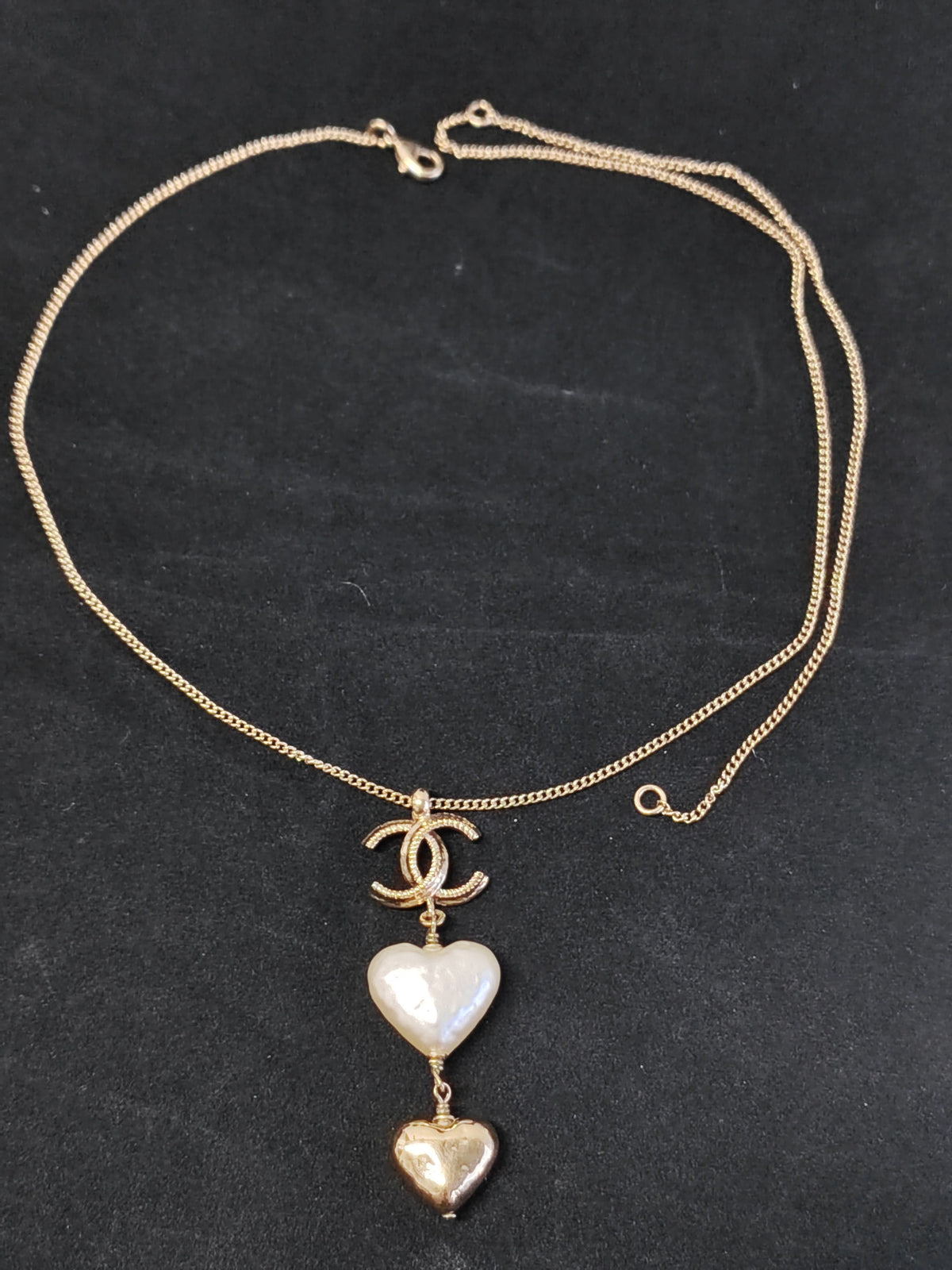 Chanel - Other - Gold-tone metal with a white heart-shaped faux-pearl pendant and a gold-tone heart charm. - Multicolour