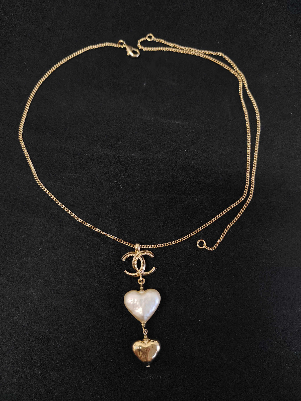 Chanel - Other - Gold-tone metal with a white heart-shaped faux-pearl pendant and a gold-tone heart charm. - Multicolour