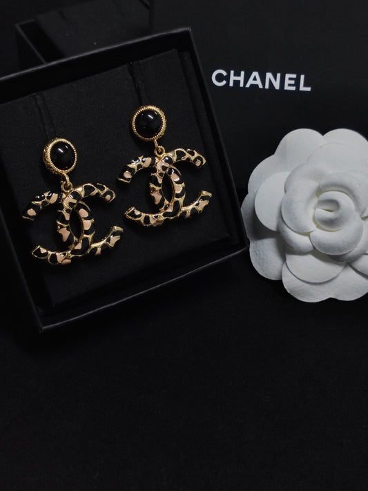Chanel - Other - Gold-tone metal with black and beige decorative inlays. - Multicolour