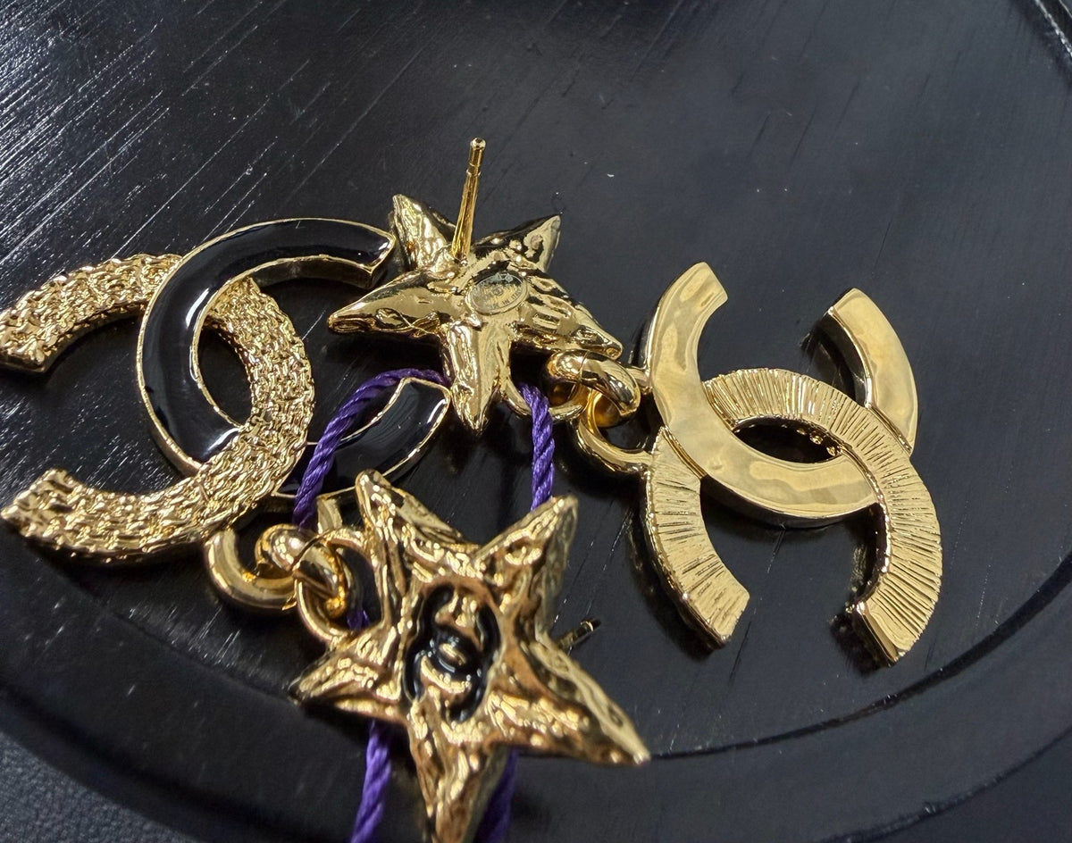 Chanel - Other - Gold-tone metal with black enamel accents. - Gold