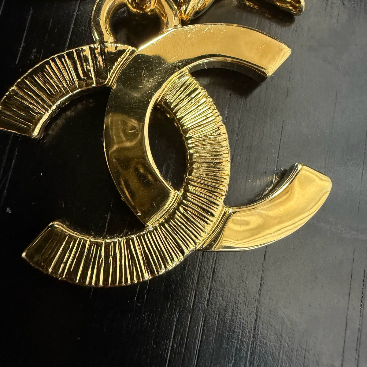 Chanel - Other - Gold-tone metal with black enamel accents. - Gold