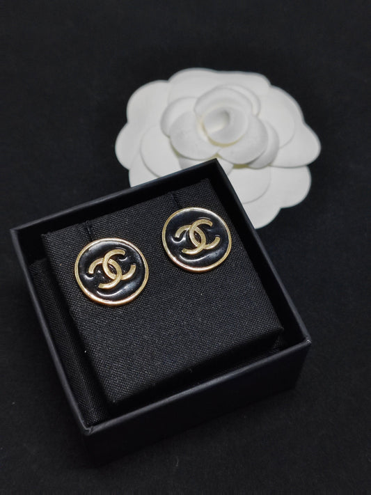 Chanel - Other - Gold-tone metal with black enamel-like accents; exact alloy unspecified. - Black
