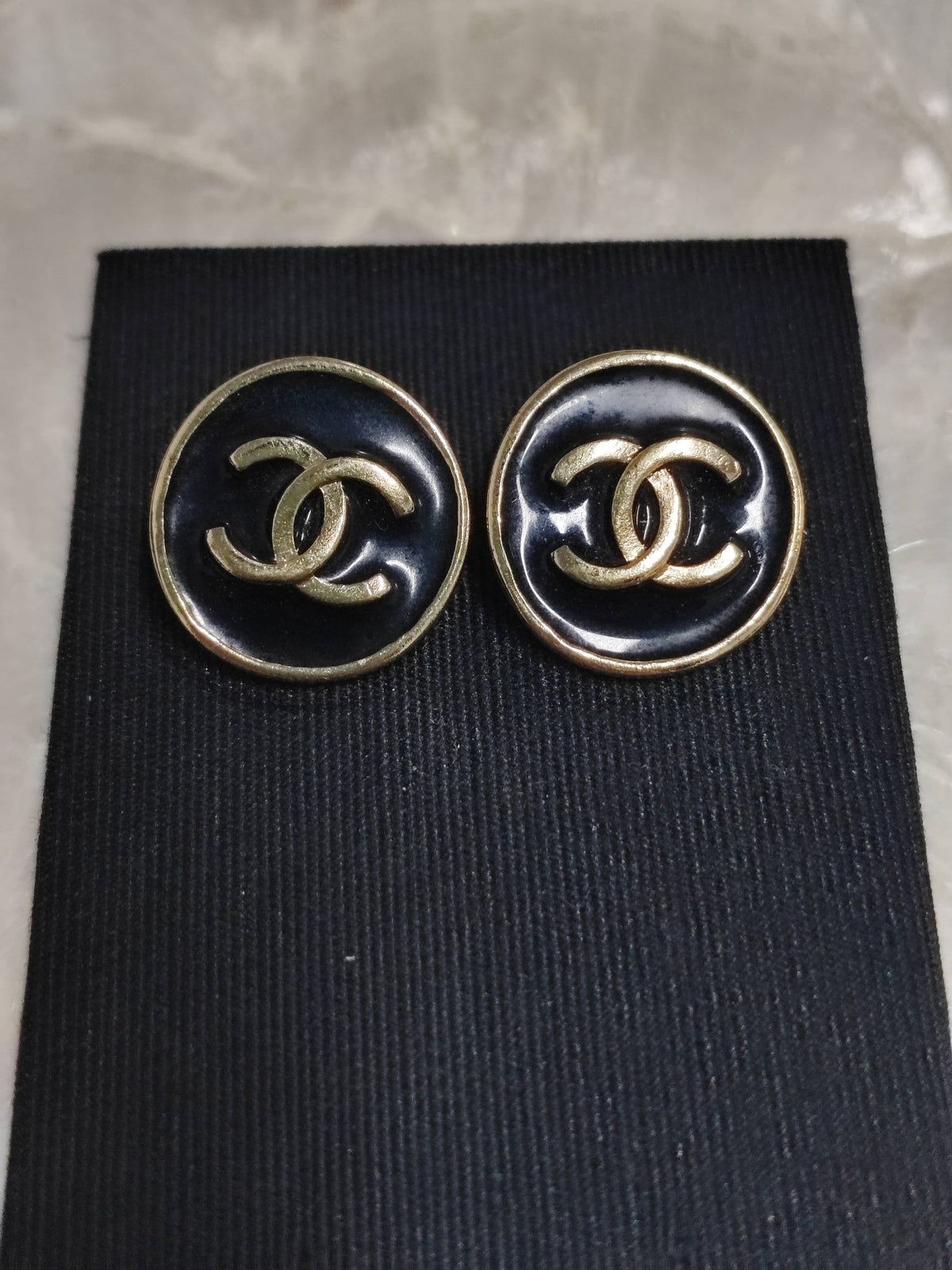 Chanel - Other - Gold-tone metal with black enamel-like accents; exact alloy unspecified. - Black