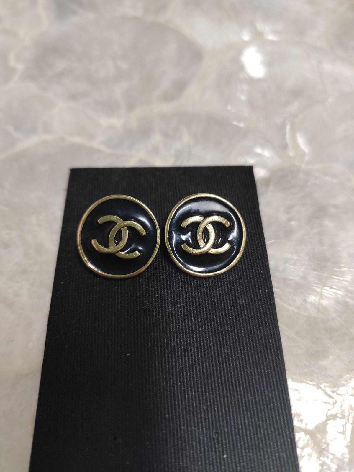 Chanel - Other - Gold-tone metal with black enamel-like accents; exact alloy unspecified. - Black