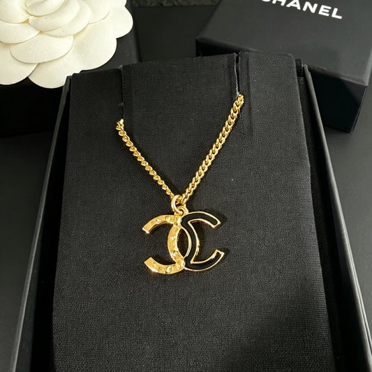 Chanel - Other - Gold-tone metal with black enamel. - Multicolour