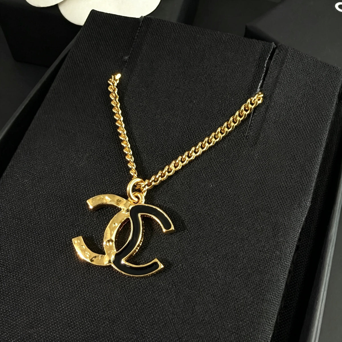 Chanel - Other - Gold-tone metal with black enamel. - Multicolour