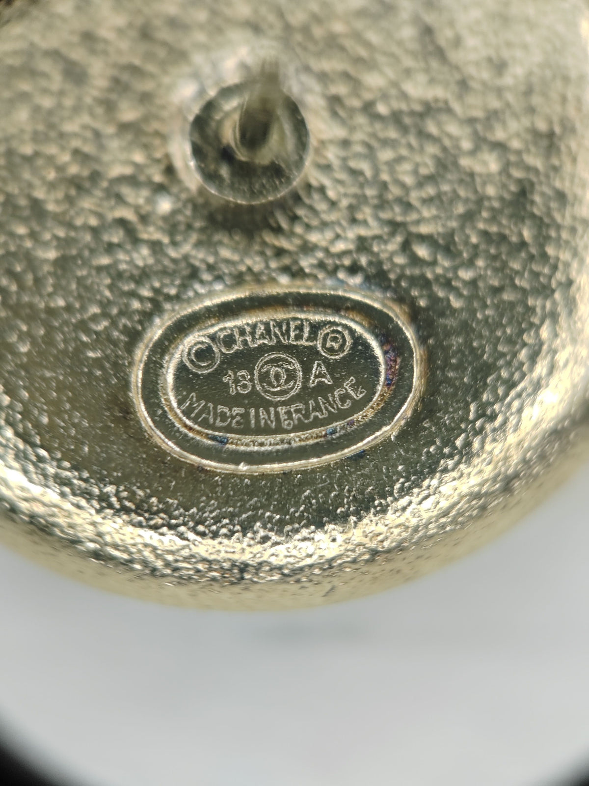 Chanel - Other - Gold-tone metal with black enamel or resin and dark glass crystal accents. - Black