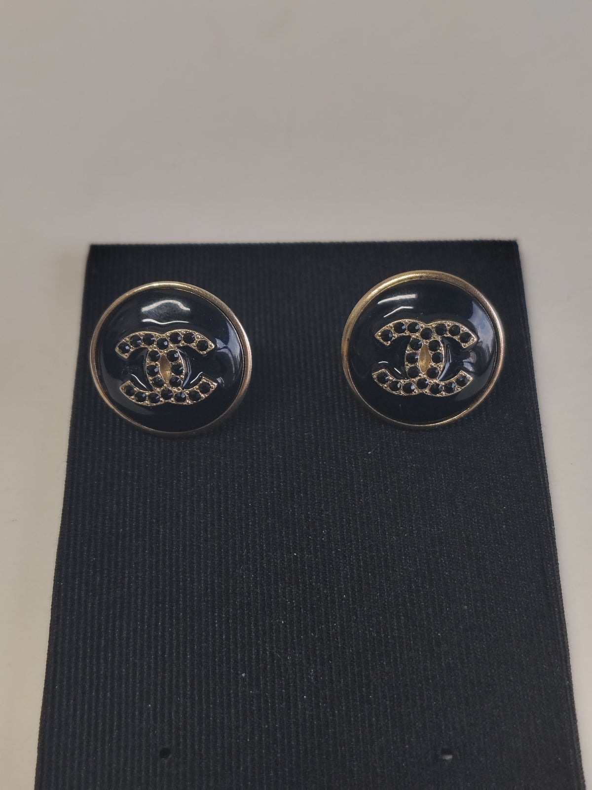 Chanel - Other - Gold-tone metal with black enamel or resin and dark glass crystal accents. - Black