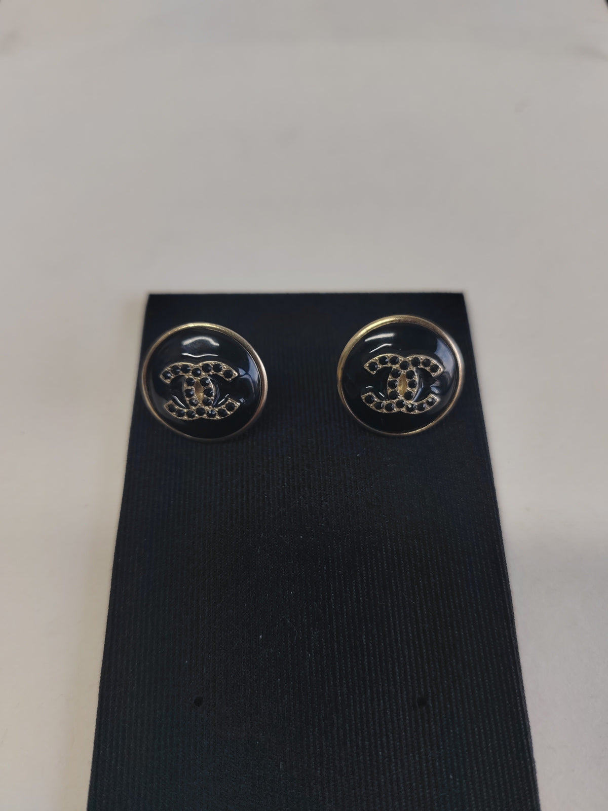 Chanel - Other - Gold-tone metal with black enamel or resin and dark glass crystal accents. - Black