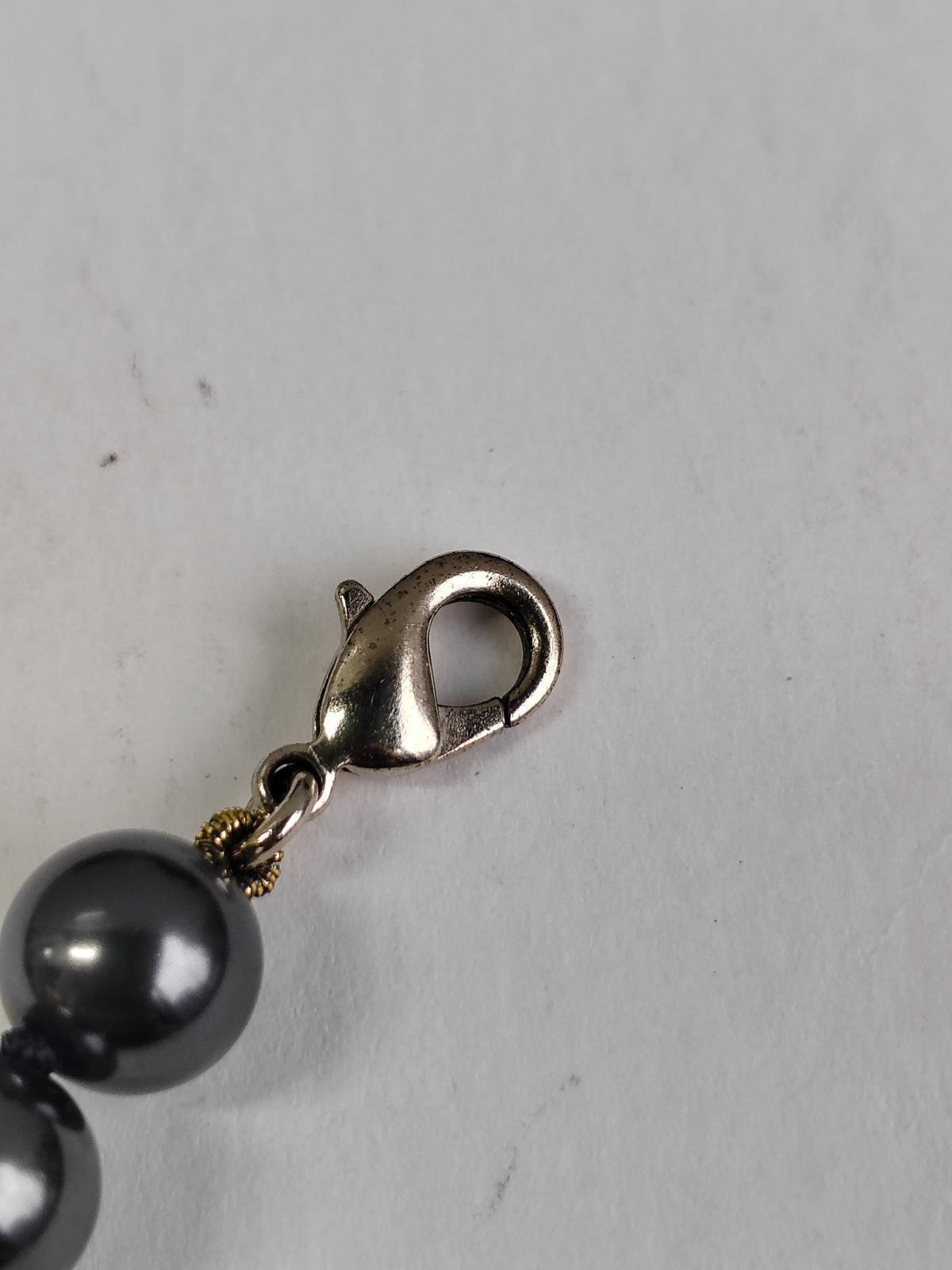 Chanel - Other - Gold-tone metal with black faux-pearl beads. - Black