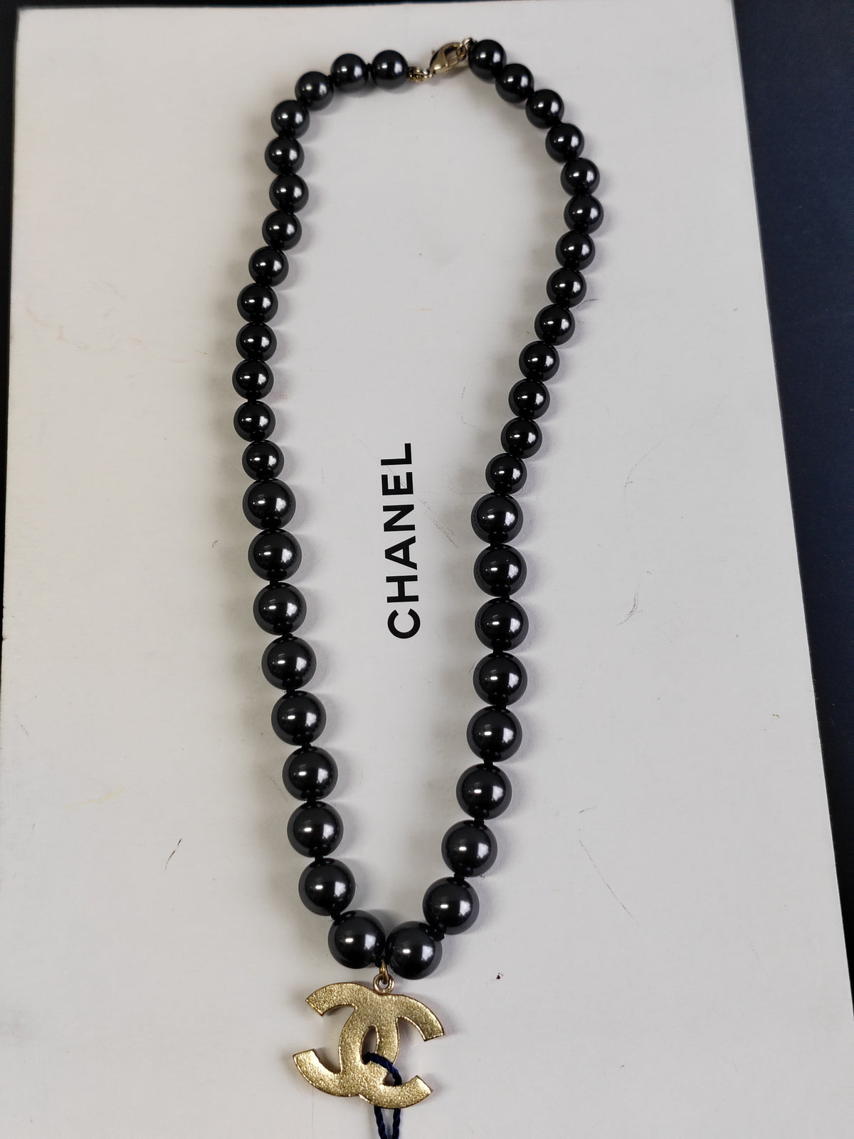 Chanel - Other - Gold-tone metal with black faux-pearl beads. - Black